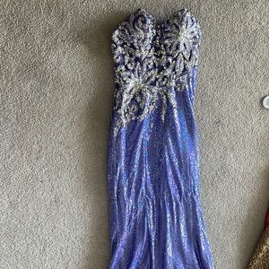 Beautiful beaded and sequin covered prom dress, longer at back
